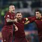 Roma's midfielder Radja Nianggolan (C) celebrates with teammates after scoring during the Italian Serie A football match Roma vs AC Milan at the Olympic Stadium in Roma on December 12, 2016