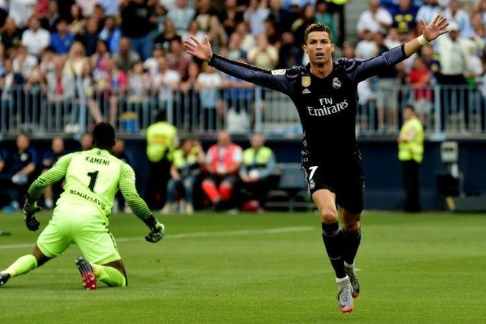 Real Madrid's forward Cristiano Ronaldo celebrates after scoring against Malaga on May 21, 2017