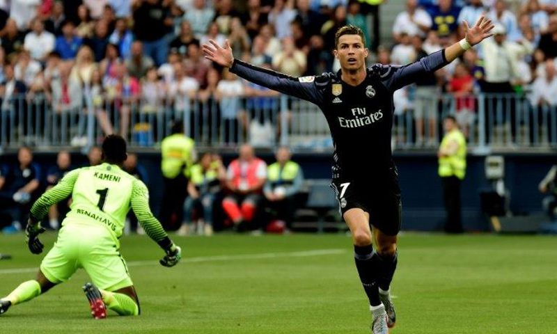 Real Madrid's forward Cristiano Ronaldo celebrates after scoring against Malaga on May 21, 2017