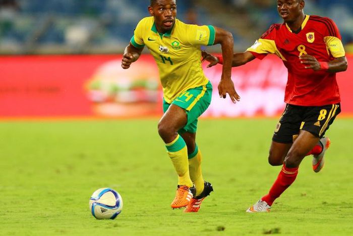 Thulani Hlatshwayo (L), captain of South African Premiership leaders Bidvest Wits FC, in action for the national team against Angola