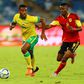 Thulani Hlatshwayo (L), captain of South African Premiership leaders Bidvest Wits FC, in action for the national team against Angola