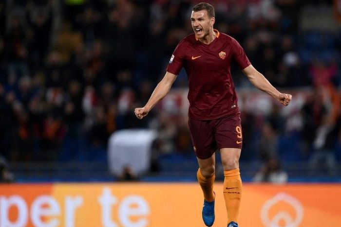 Roma's forward Edin Dzeko celebrates after scoring against Sassuolo at the Olympic Stadium in Rome on March 19, 2017