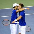 France's Pierre-Hugues Herbert (L) and Nicolas Mahut celebrate their their victory over Japan in the Davis Cup first round on February 4, 2017
