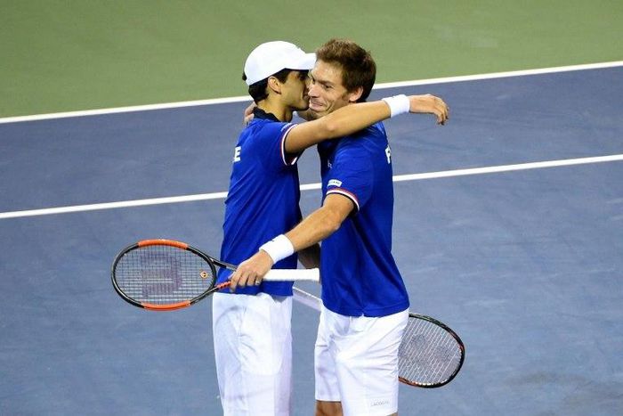 France's Pierre-Hugues Herbert (L) and Nicolas Mahut celebrate their their victory over Japan in the Davis Cup first round on February 4, 2017