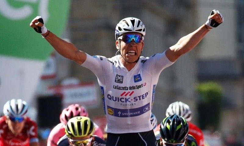 Luxembourg's Bob Jungels celebrates as he crosses the finish line to win the 15th stage of the 100th Giro d'Italia on May 21, 2017