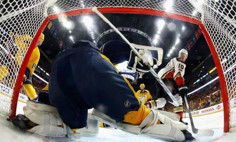 The Nashville Predators goalie Pekka Rinne makes a save against Corey Perry of the Anaheim Ducks in Game Four of the NHL Western Conference finals, at Bridgestone Arena in Nashville, Tennessee, on May 18, 2017