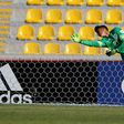 England's goalkeeper Alfie Whiteman jumps for the ball after the shot of Guinea's Naby Bangoura (not in picture) during an Under 17 World Cup match at La Portada stadium in La Serena on October 17, 2015