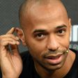 Former French striker Thierry Henry gestures as he speaks with the media during a promotional event in Mumbai on October 26, 2016