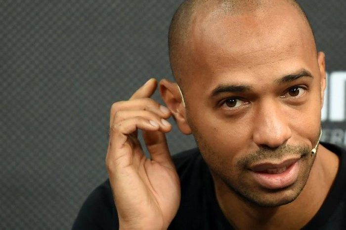 Former French striker Thierry Henry gestures as he speaks with the media during a promotional event in Mumbai on October 26, 2016