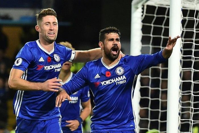 Chelsea's Diego Costa (R) celebrates with teammate Gary Cahill after scoring a goal during an English Premier League match against Everton, at Stamford Bridge in London, on November 5, 2016