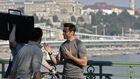 Australian actor Hugh Jackman chats with crew members on the Szabadsag bridge in Budapest during a film shoot, in 2011