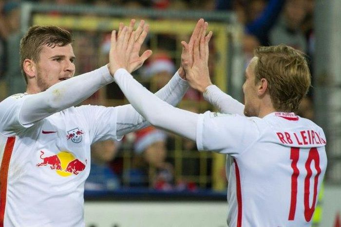 Leipzig's forward Timo Werner (L) celebrates with teammate forward Emil Forsberg after he scored during the German first division Bundesliga football match against SC Freiburg November 25, 2016
