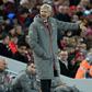 Arsenal's French manager Arsene Wenger (R) gestures to the fourth offficial, Andre Marriner during the English Premier League football match between Liverpool and Arsenal at Anfield in Liverpool, north west England on March 4, 2017