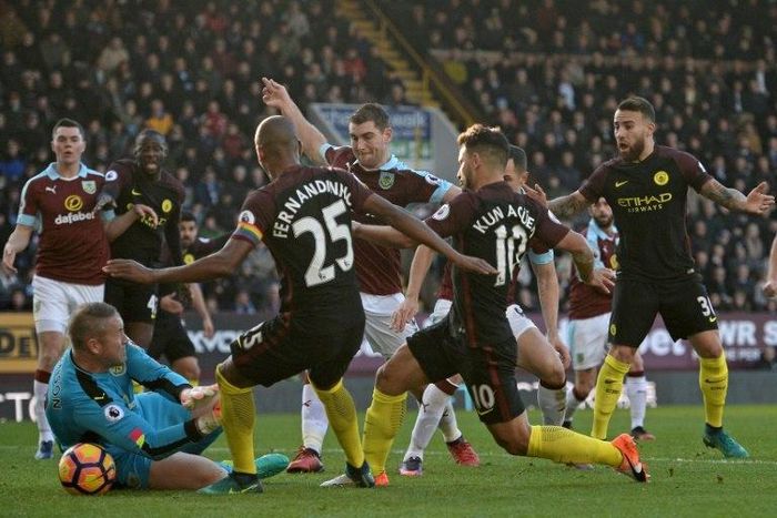 Manchester City's Sergio Aguero (3R) came up with the goals at Burnley that rescued three points for City after they had fallen behind