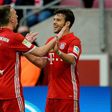 Bayern Munich's midfielder Franck Ribery (L) celebrates his 0-3 goal with defender Juan Bernat during the German First division Bundesliga football match against Cologne March 4, 2017