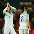 England's striker Wayne Rooney celebrates after England won the World Cup 2018 qualification match agaiinst Scotland at Wembley stadium in London on November 11, 2016