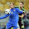 Ukraine's Roman Zozulya (L) vies with Wales' Chris Gunter during the international friendly football match between Ukraine and Wales at the Olimpiyskiy stadium in Kiev on March 28, 2016
