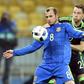 Ukraine's Roman Zozulya (L) vies with Wales' Chris Gunter during the international friendly football match between Ukraine and Wales at the Olimpiyskiy stadium in Kiev on March 28, 2016