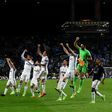 Juventus' players celebrate their 2-0 victory against Porto at the end of the UEFA Champions League round of 16 second leg football match in Porto on February 22, 2017