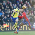 Everton's defender Seamus Coleman (L) heads the ball under the eye of Crystal Palace's defender Jeffrey Schlupp on January 21, 2017