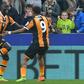 Hull City's Oumar Niasse (L) celebrates with teammate Abel Hernandez after scoring the opening goal of their English Premier League football match against Swansea City on March 11, 2017