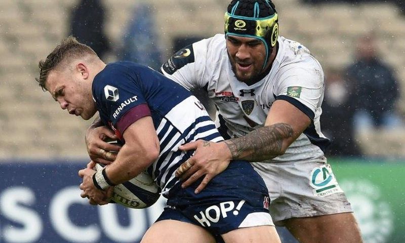 Bordeaux-Begles flyhalf Ian Madigan (left) is tackled by Clermont lock Sebastien Vahaamahina during their European Champions Cup clash in Bordeaux on January 15, 2017