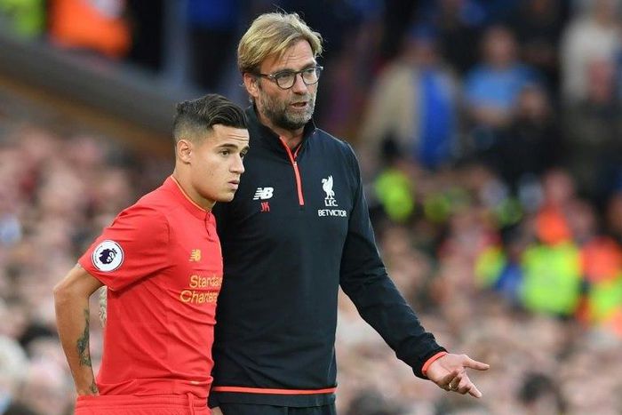 Brazil international Philippe Coutinho (L) has been one of Liverpool's key performers this season and he hailed the resilience that coach Jurgen Klopp (R) has instilled in the squad