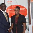 Dr. William Derban-Director for Inclusive Banking & CSR at Fidelity Bank and Rosy Fynn, Marketing Director-Airtel Ghana at the launch.