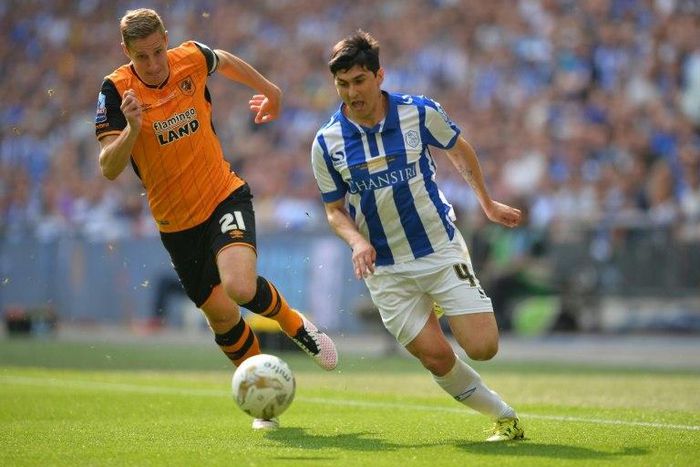Hull City's Michael Dawson (L), seen in May 2016, scored a goal to bring the match against West Bromwhich Albion to a 1-1 draw November 26, 2016
