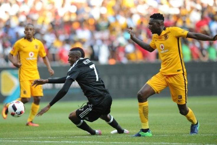 Tendai Ndoro of Orlando Pirates (L) vies with Erick Mathoho of Kaiser Chiefs during their derby football match on October 29, 2016 at the FNB Stadium in Johannesburg