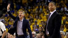 Coaches Steve Kerr (L) of the Golden State Warriors and Tyronn Lue of the Cleveland Cavaliers stand during Game 2 of the 2017 NBA Finals at ORACLE Arena on June 4, 2017
