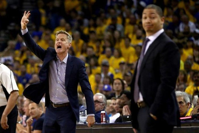 Coaches Steve Kerr (L) of the Golden State Warriors and Tyronn Lue of the Cleveland Cavaliers stand during Game 2 of the 2017 NBA Finals at ORACLE Arena on June 4, 2017