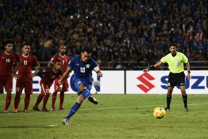 Thailand's Teerasil Dangda attempts to score a penalty, but fails, during their AFF Suzuki Cup final match against Indonesia, at Rajamangala Stadium in Bangkok, on December 17, 2016