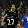 Chelsea's midfielder Pedro celebrates in the arms of midfielder Willian after scoring their third goal during the English Premier League football match between Leicester City and Chelsea on January 14, 2017