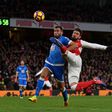 Arsenal's Olivier Giroud (R) has shot blocked by Bournemouth's Steve Cook during the match in London on November 27, 2016