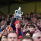 Lincoln fans celebrate after winning the English FA Cup fifth round football match between Lincoln City and Burnley February 18, 2017