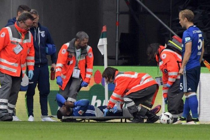 Breel Embolo is taken off the pitch on a stretcher after an injury in Schalke 04's game against FC Augsburg in Augsburg on October 15, 2016