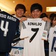 Japanese fans of Spanish football club, Real Madrid await the team's arrival at the Haneda International airport in Tokyo on December 12, 2016
