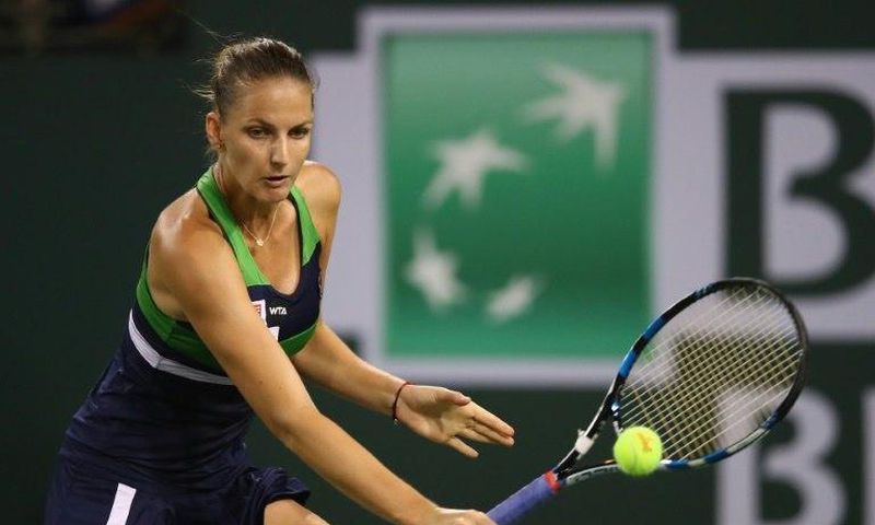 Karolina Pliskova of the Czech Republic plays a backhand against Garbine Muguruza of Spain on her way to a 7-6 (7/2), 7-6 (7/5) quarter final win at Indian Wells