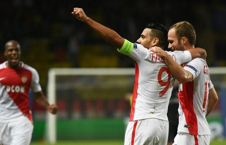 Monaco's Valere Germain (R) celebrates with teammate Radamel Falcao after scoring a goal during their UEFA Champions League Group E match against CSKA Moscow, at the Louis II Stadium in Monaco, on November 2, 2016