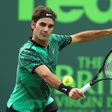 Roger Federer of Switzerland returns a shot against Frances Tiafoe during day 6 of the Miami Open at Crandon Park Tennis Center on March 25, 2017 in Key Biscayne, Florida