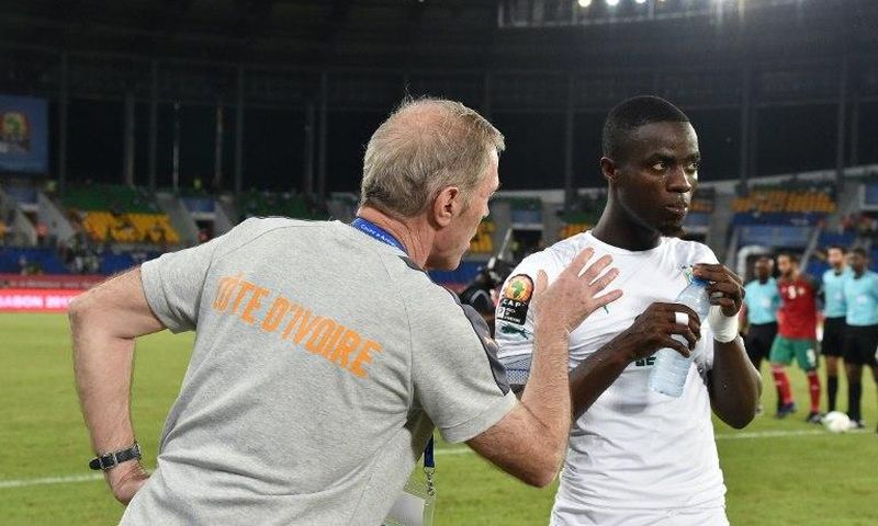Ivory Coast's coach Michel Dussuyer (L) speaks to defender Eric Bailly ahead of the team's Africa Cup of Nations match against Morocco on January 24, 2017