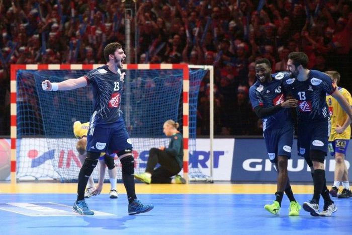 France's pivot Ludovic Fabregas (L), France's centre back Nikola Karabatic and France's right wing Luc Abalo celebrate after winning the 25th IHF Men's World Championship 2017 quarter final handball match France vs Sweden on January 24, 2017