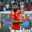 Wales' midfielder Joe Ledley and his daughter Reeva are pictured following the Euro 2016 round of sixteen football match against Northern Ireland June 25, 2016