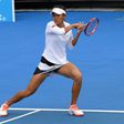China's Zhang Shuai hits a return during the women's doubles second round match against India's Sania Mirza and the Czech Republic's Barbora Strycova on day five of the Australian Open tennis tournament in Melbourne on January 20, 2017