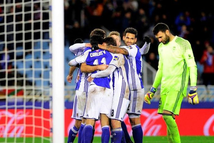 Real Sociedad's players celebrate their team's second goal during the Spanish league football match Real Sociedad vs CA Osasuna at the Anoeta stadium in San Sebastian on February 5, 2017