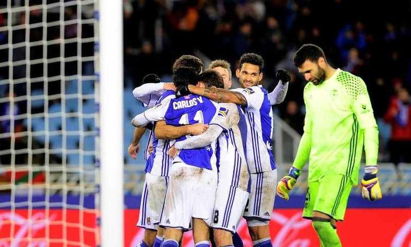 Real Sociedad's players celebrate their team's second goal during the Spanish league football match Real Sociedad vs CA Osasuna at the Anoeta stadium in San Sebastian on February 5, 2017