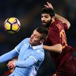 Lazio's Sergej Milinkovic-Savic (L) vies with Roma's Federico Fazio during thire Italian TIM Cup 1st leg semifinal football match on March 1, 2017 at the Olympic stadium in Rome