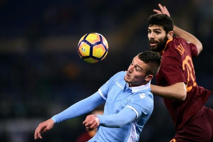 Lazio's Sergej Milinkovic-Savic (L) vies with Roma's Federico Fazio during thire Italian TIM Cup 1st leg semifinal football match on March 1, 2017 at the Olympic stadium in Rome