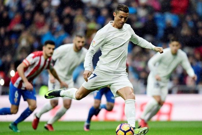 Real Madrid's Portuguese forward Cristiano Ronaldo plays against Real Sporting de Gijon at the Santiago Bernabeu stadium in Madrid on November 26, 2016